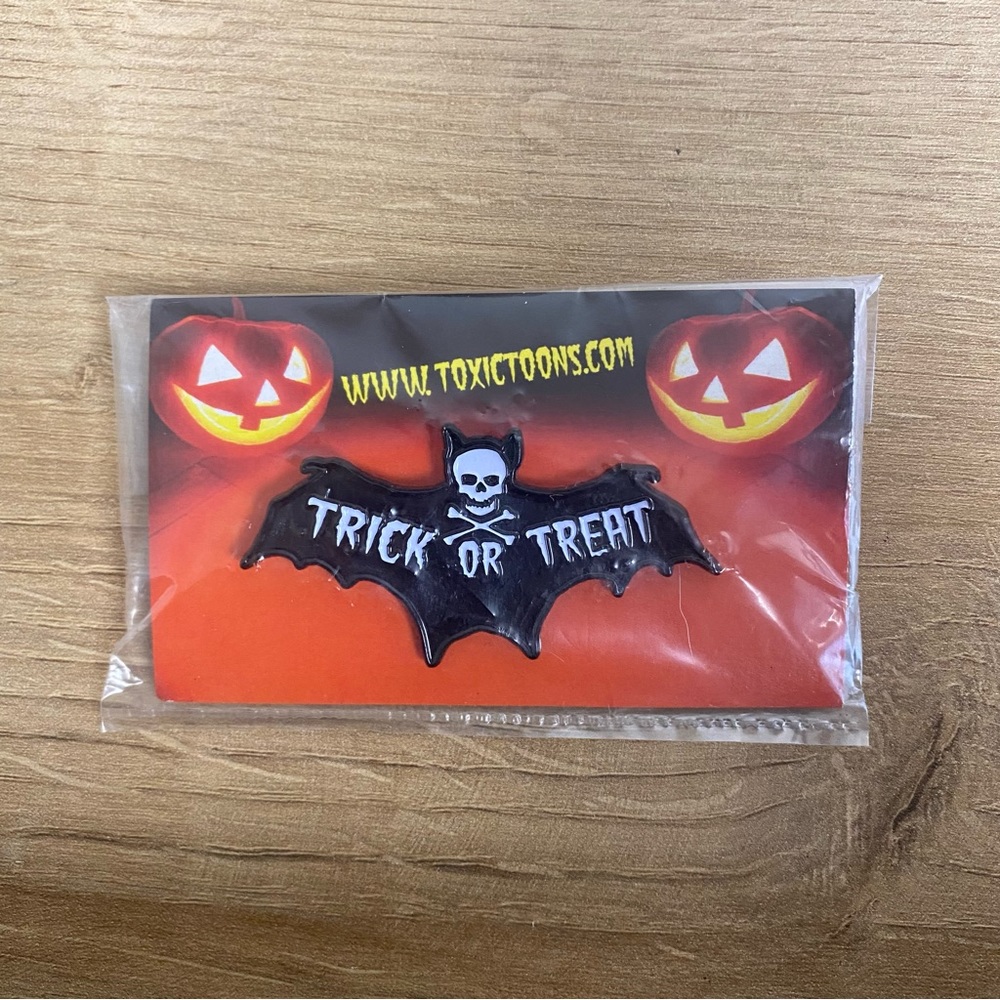 Toxictoons Trick Or Treat Enamel Pin - Original unopened package.